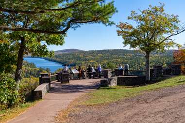 people enjoying the view from brockway mountain lookout