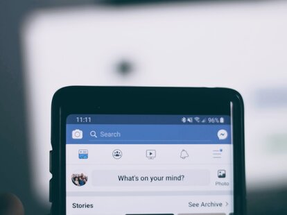 The top half of an iPhone showing the mobile home screen for Facebook.