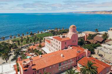 An aerial view of the coral pink, oceanfront hotel La Valencia. 