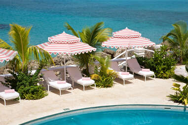 The pool deck near the ocean at Cobbler's Cove. 