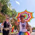 two festival-goers blowing large bubbles at pride marfa