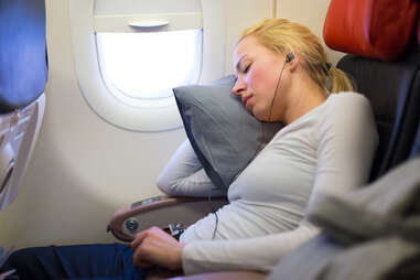 sleeping woman on airplane