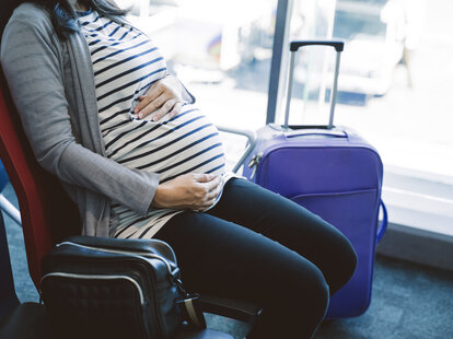 pregnant woman in airport