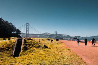 people walking with view of golden gate bridge