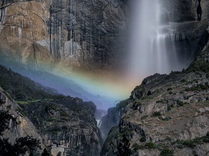 Lunar rainbow at Yosemite Lower Falls during a full moon in Yosemite National Park.