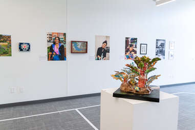 White taped floors and art-filled walls at Envision Arts Gallery and Community Engagement Center