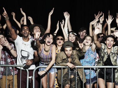 People at concert having fun