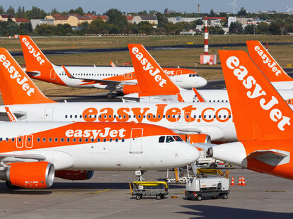 EasyJet Airbus A320 airplanes tails at an Airport in Europe.