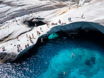 people enjoying sarakiniko beach, milos, greece