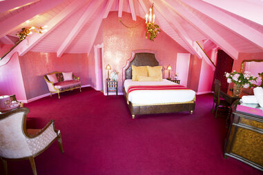 A hot pink hotel room at the Madonna Inn.