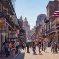 Bourbon Street in New Orleans, Louisiana during a hot summer day. 