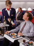man in first class seat on airplane