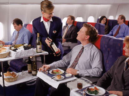 man in first class seat on airplane