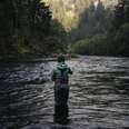 woman fly fishing in river