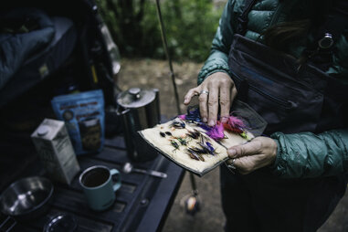 woman holding fishing gear
