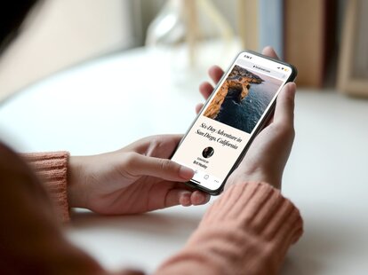 close up of someone booking a trip on fora mobile