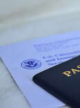 A U.S. passport application and passport on a table. 