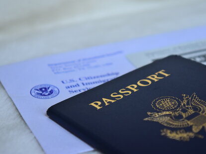 A U.S. passport application and passport on a table.