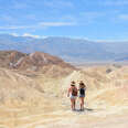 Friends hiking in the mountains on vacation trip at Death Valley National Park.
