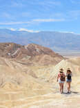 Friends hiking in the mountains on vacation trip at Death Valley National Park.