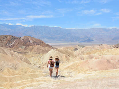Friends hiking in the mountains on vacation trip at Death Valley National Park.