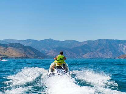 man jet skiing on lake chelan