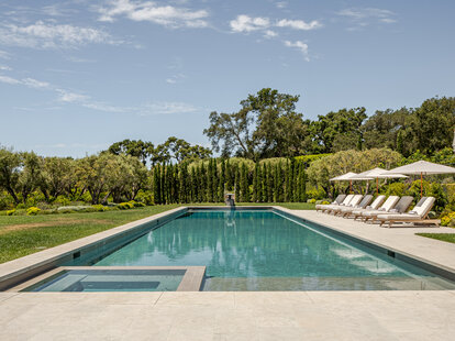 A minimalist luxury backyard pool at Gwyneth Paltrow’s house in Montecito, California.