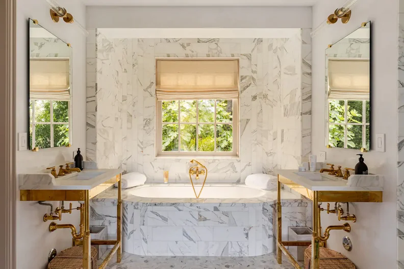 The fancy, marble and gold bathroom with large bathtub in Gwyneth Paltrow’s Airbnb.