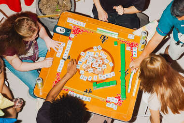 Players in the middle of a mahjong game
