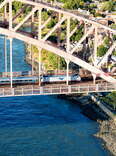  Aerial view of and Amtrak train crossing the Hell Gate Bridge in New York City.