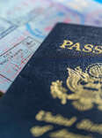 A close up of US Passport and entry stamps.