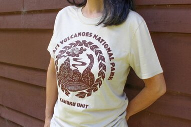 Woman wearing Hawai’i Volcanoes National Park t-shirt