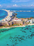 Aerial panoramic view of the northern peninsula of the Hotel Zone (Zona Hotelera) in Cancún, Mexico.