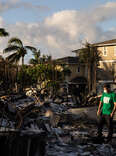  A Mercy Worldwide volunteer makes damage assessment of charred apartment complex in the aftermath of a wildfire in Lahaina, western Maui, Hawaii on August 12, 2023. 