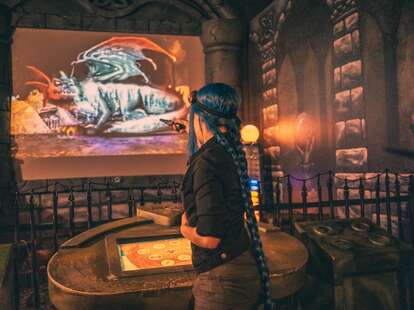 Girl playing MagiQuest