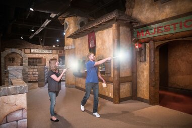 adults playing MagiQuest