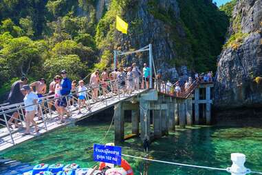 tourists on walkway to Maya Bay