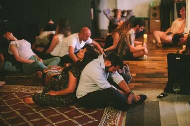 Participants taking part in the back-to-back leaning exercise