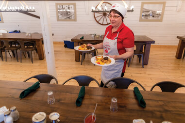 woman serving meals in battle harbour