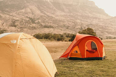 Two tents on grassy field