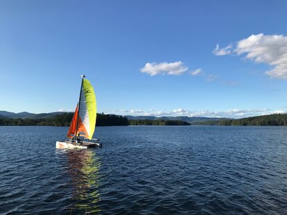people enjoying a lake