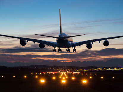 An airplane just before landing in the early morning