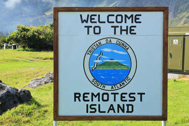 sign at tristan da cunha that reads "welcome to the remotest island"