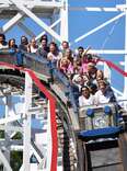 People riding the Thunderbolt roller coaster