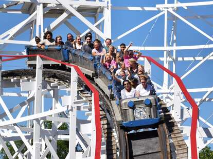 People riding the Thunderbolt roller coaster