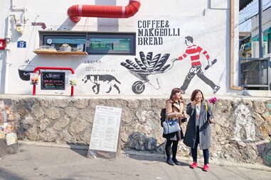 tourists taking photos at ihwa mural village