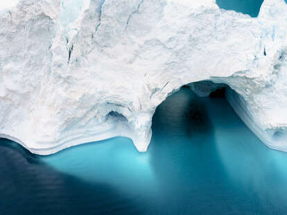 Aerial view of the icebergs on arctic ocean at Greenland. Glaciers are melting at north circle of the world. Climate change to close future.