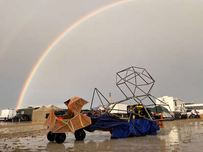 The undated image shows a rainbow seen over the muddy grounds of the “Burning Man” festival. Tens of thousands of visitors to the desert festival “Burning Man” are stranded on the site in the US state of Nevada after heavy rainfall over the weekend.