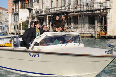 the cast of the real housewives of new jersey riding a boat in venice