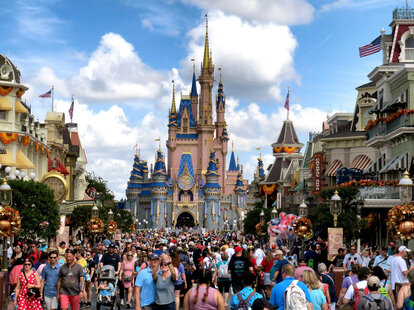 Crowds fill Main Street USA in front of Cinderella Castle at the Magic Kingdom on the 50th anniversary of Walt Disney World, in Lake Buena Vista, Florida, on Oct. 1, 2021.